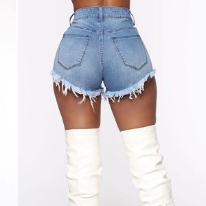 Fashion Nova denim medium blue wash cheeky shorts. Size 3